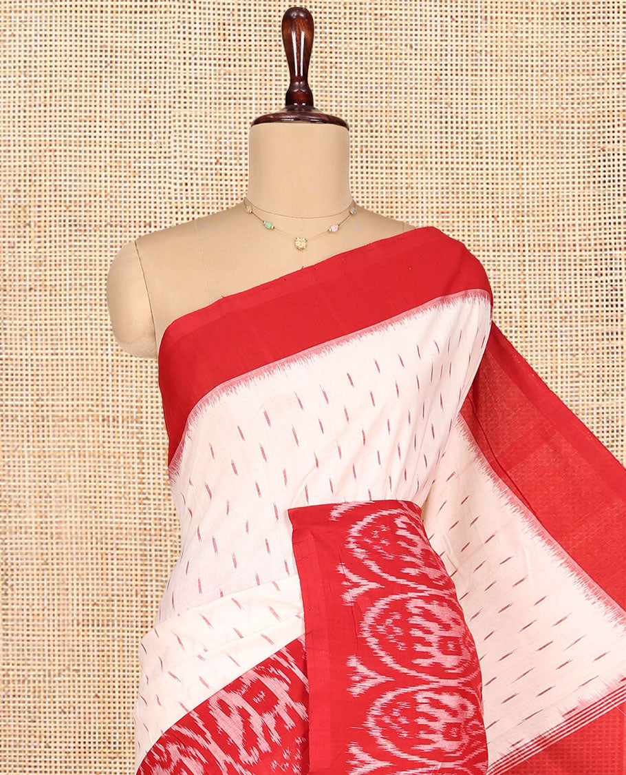 Cream Ikkat Cotton Saree, Features Ikkat Buttas All Over Its Body, Complemented by a Contrast Ikkat-Style Round Elephant Border, Intricately Designed Pallu, and Has No Blouse