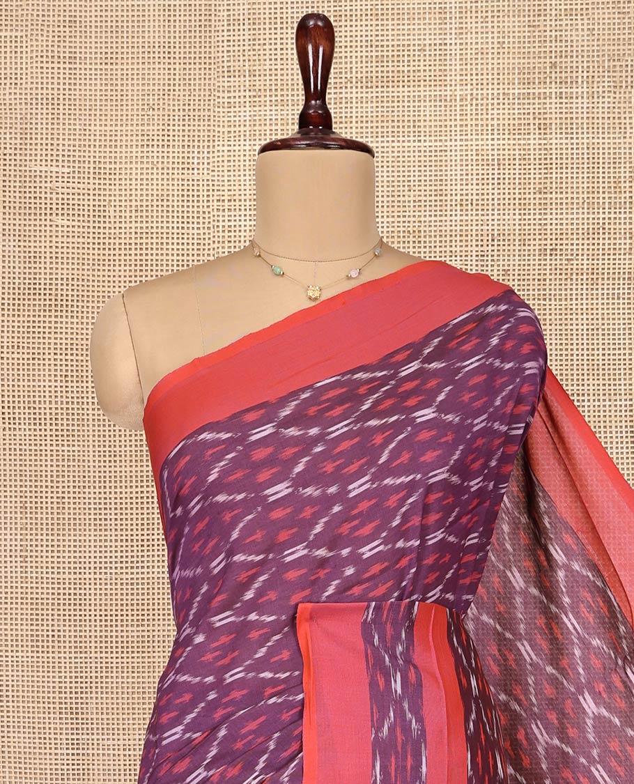 Purple Ikkat Cotton Saree, Adorned with Ikkat-Style Ogee Patterns on Its Body, Complemented by Contrast Ikkat-Textured Border, Pallu Steeped with Ikkat Ogee Patterns, and Has No Blouse