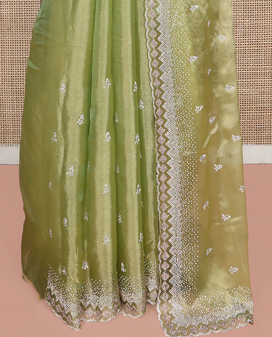 Green Designer Saree, Gleamed Up with Stone Embroidered Buttas on Its Body, Highlighted by Scallop Stone Work Border, Pallu of Stone Work, and Paired with a Heavily Stone Embellished Matching Blouse