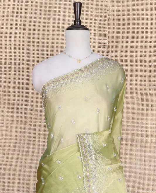 Green Designer Saree, Gleamed Up with Stone Embroidered Buttas on Its Body, Highlighted by Scallop Stone Work Border, Pallu of Stone Work, and Paired with a Heavily Stone Embellished Matching Blouse