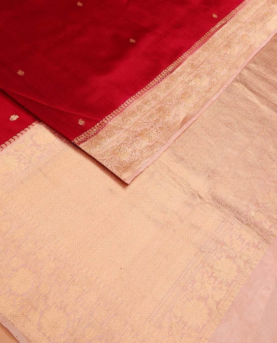 Red Raw Mango Silk Saree Decorated with Buttas, Featuring a Contrast Floral Creeper Zari-Designed Border, a Pallu Adorned with Chevron Zari Designs, Paired with a Contrast Blouse