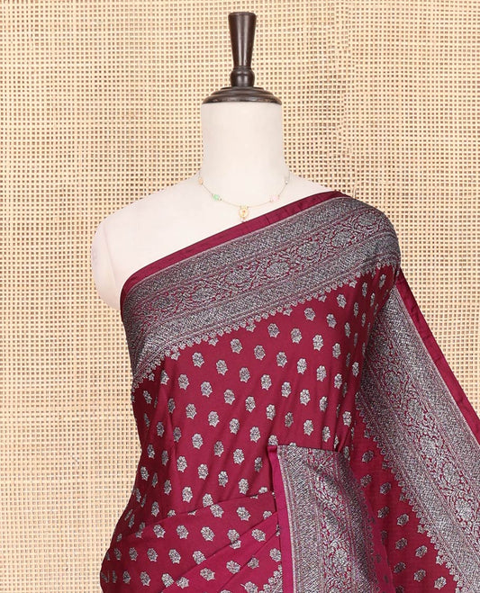 Maroon Fancy Georgette Saree Richly Detailed with Zari Buttas, Highlighted by a Traditional Zari Design Border, Grandly Woven Pallu Featuring Floral Jaal Zari Designs, and Paired with a Matching Blouse