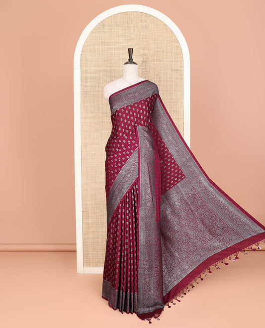 Maroon Fancy Georgette Saree Richly Detailed with Zari Buttas, Highlighted by a Traditional Zari Design Border, Grandly Woven Pallu Featuring Floral Jaal Zari Designs, and Paired with a Matching Blouse