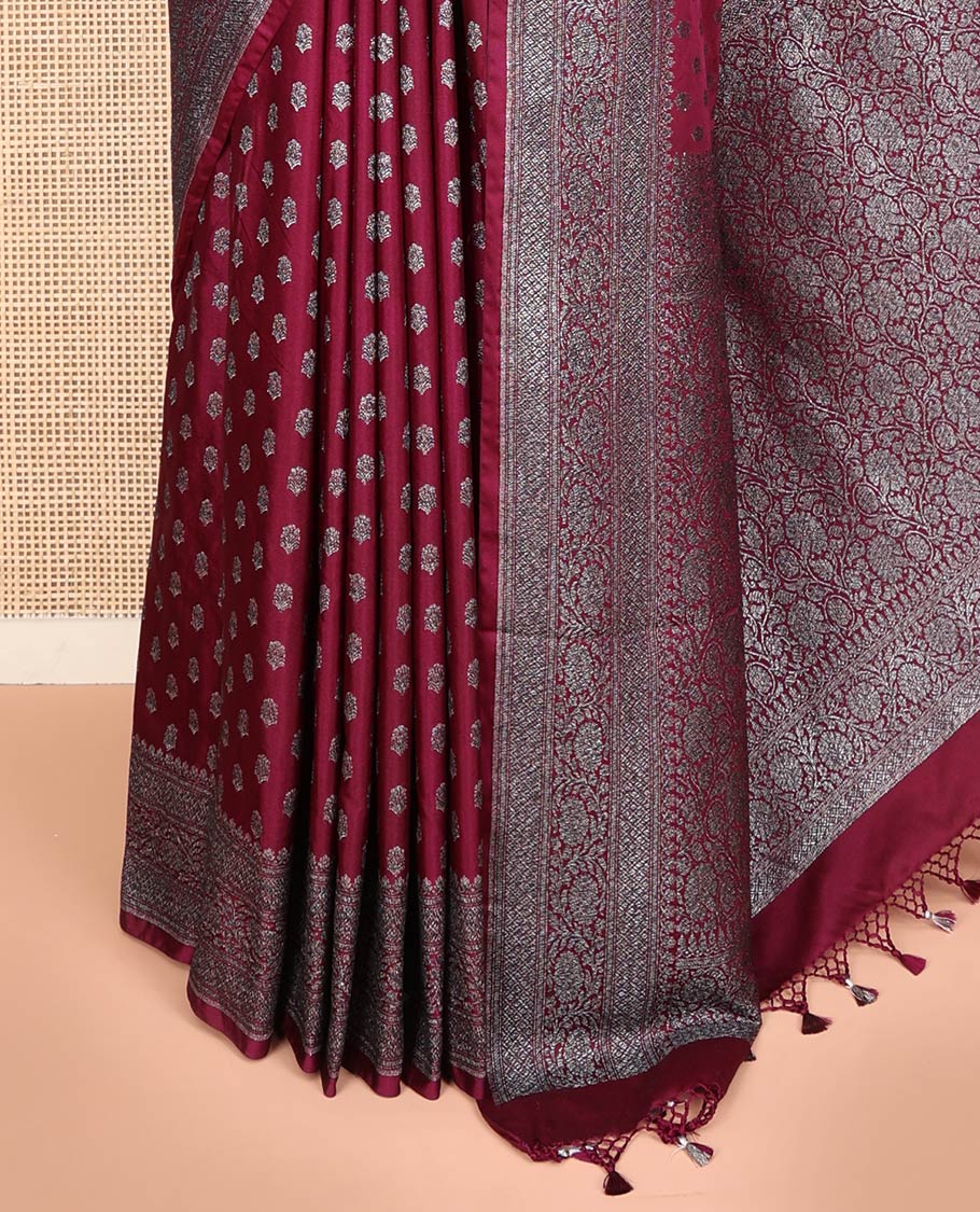 Maroon Fancy Georgette Saree Richly Detailed with Zari Buttas, Highlighted by a Traditional Zari Design Border, Grandly Woven Pallu Featuring Floral Jaal Zari Designs, and Paired with a Matching Blouse