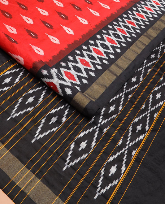 Red Ikkat Silk Saree Brightened with Ikkat Buttas, Complemented by a Contrast Ikkat Design Border, a Hazily Woven Pallu of Diamond Patterns, and a Contrast Blouse