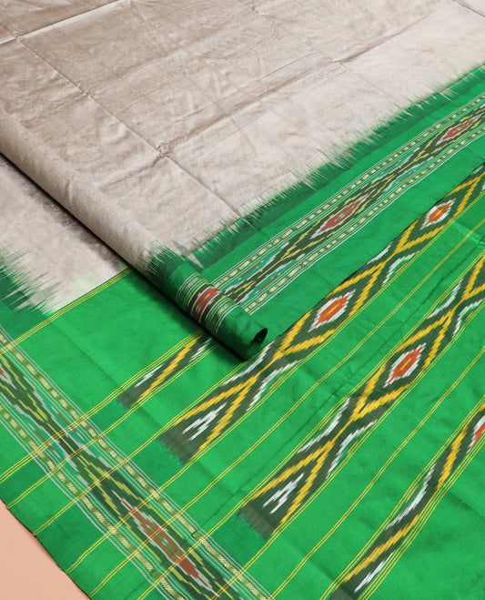 Grey Plain Ikkat Silk Saree with a Contrast Green Border Decked with a Hazy Ikkat Weave, Featuring a Pallu Flanked by Stripes and Ikkat Texture