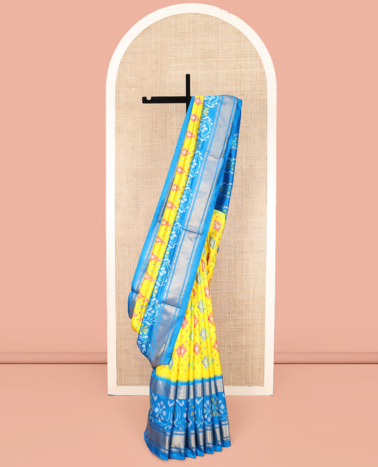 Yellow Ikkat Silk Saree, Bedecked with Meena Ikkat Buttas All Over Its Body, Complemented by a Contrast Border of Ikkat and Diamond Zari Designs, Pallu of Ogee Designs, and Paired with a Matching Blouse