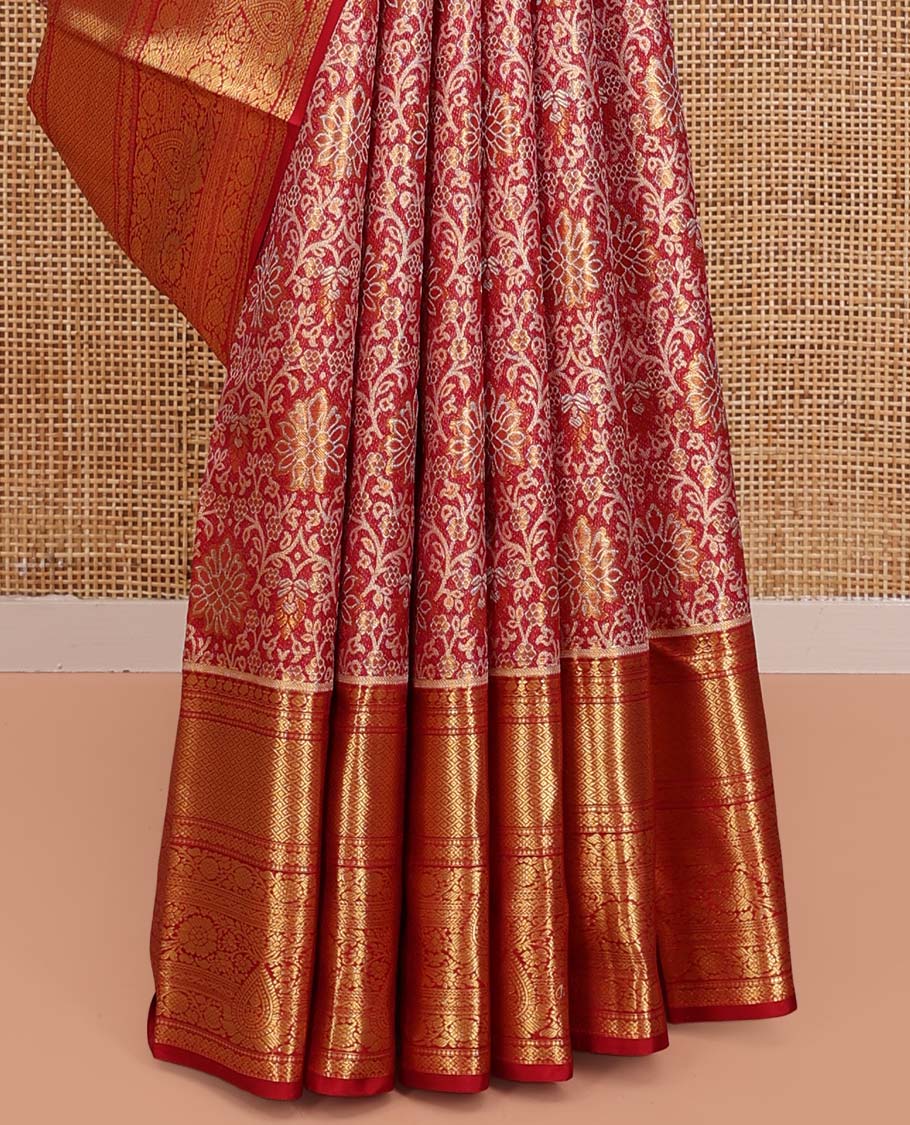 Red Kanchipuram Tissue Silk Saree, Gracefully Embellished with Jacquard Designs on Its Body, Highlighted by a Zari Border of Traditional Designs, Intricately Designed Pallu, and Paired with a Matching Blouse