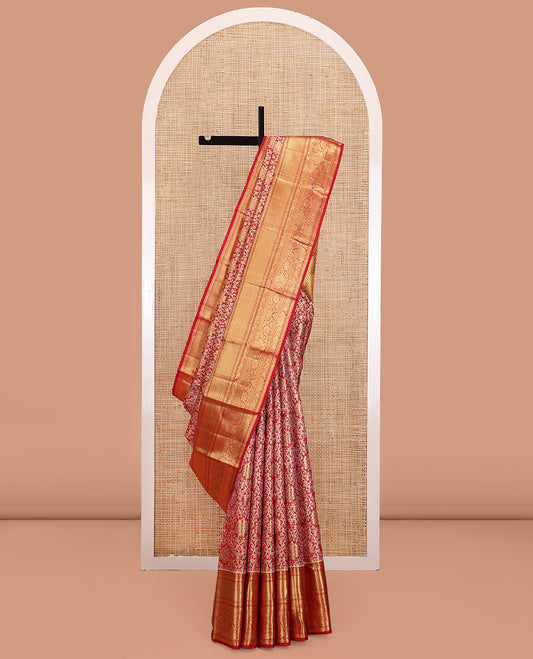 Red Kanchipuram Tissue Silk Saree, Gracefully Embellished with Jacquard Designs on Its Body, Highlighted by a Zari Border of Traditional Designs, Intricately Designed Pallu, and Paired with a Matching Blouse