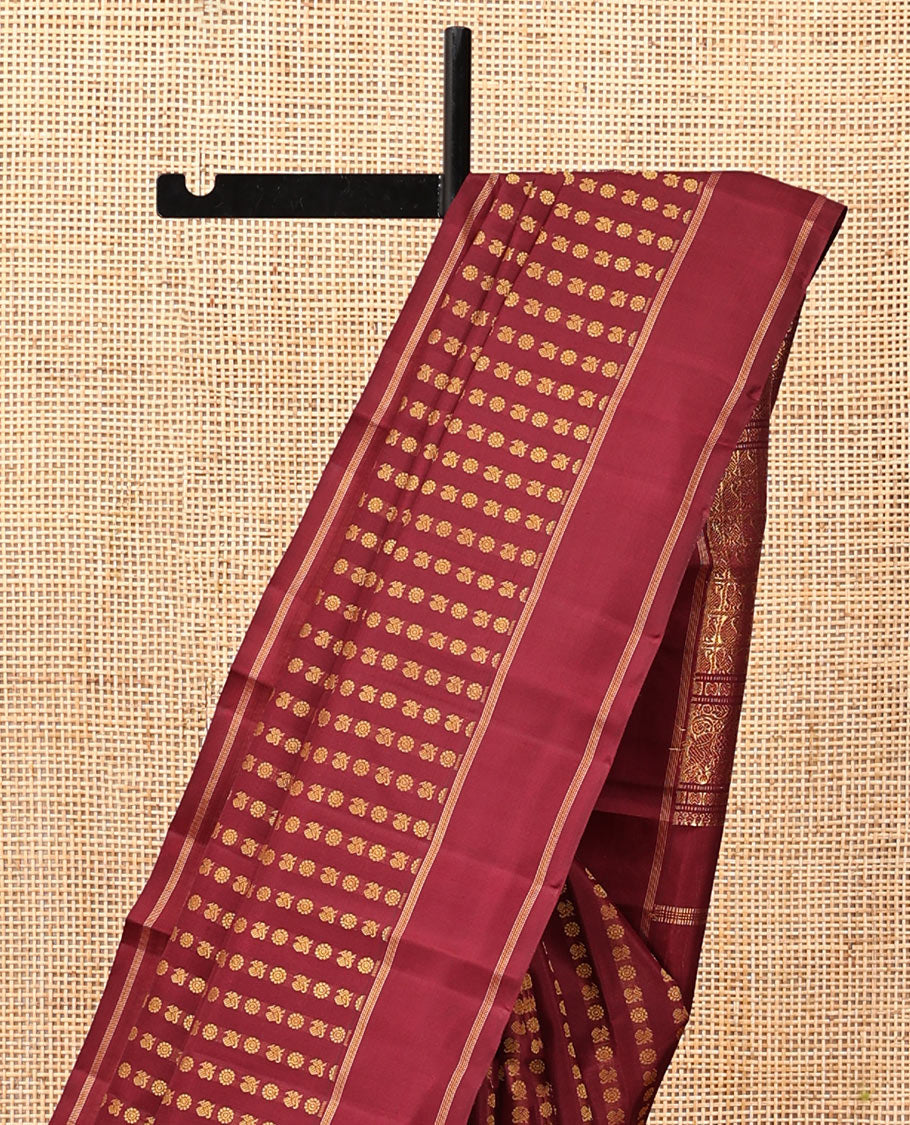 Light Maroon Kanchipuram Designer Silk Saree, Steeped in Richness of Mayil-Chakram Buttas, a Subtle Bodi Border, Butta-Enclosed Checked Pallu, and a Matching Blouse