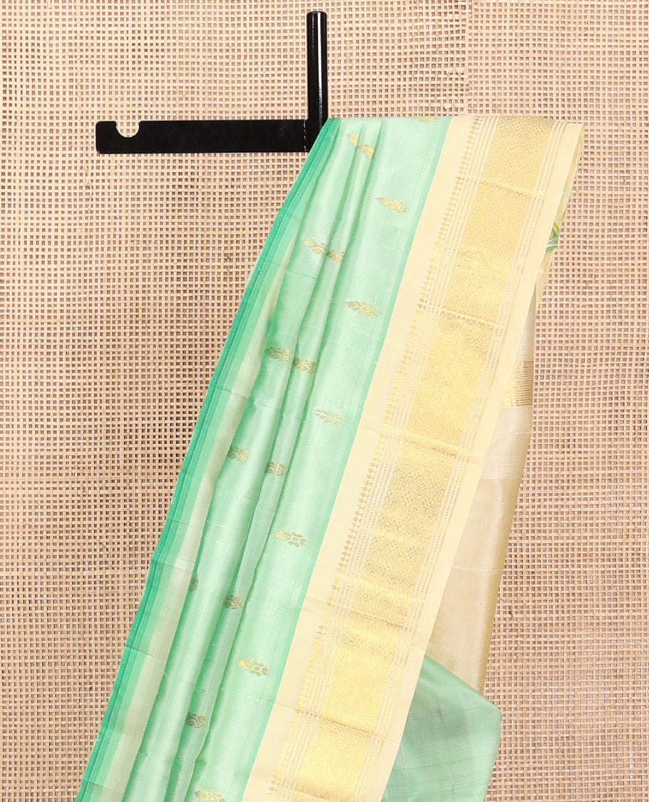 Green Kanchipuram Silk Saree, Featuring Zari Buttas, a Contrast One-Sided Border of Panner Sombu, Muthu, Banaras, and Jaal Design, Zari Design Pallu, and No Blouse