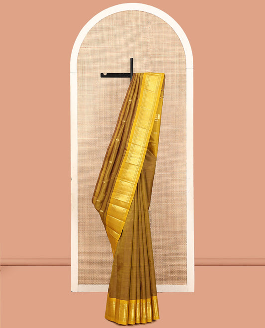 Green Kanchipuram Silk Saree, Elevated with Zari Buttas, a Contrast One-Sided Border of Paneer Sombu, Banaras, Muthu, and Jaal Designs, a Zari Design Pallu, and No Blouse