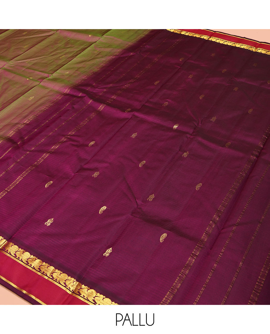 Green Kanchipuram Silk Saree, Sparsely Sparkled with Vazhaipoo Stripes and Zari Buttas on Its Body, Complemented by Contrast Rettai Pettu Border of Mayil, and Kathir Designs, Zari-Striped Pallu, and Paired with a Contrast Blouse