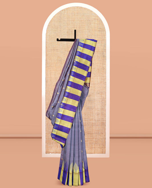 Grey Kanchipuram Silk Saree, Elevated with Zari Buttas, Complemented by a Contrast One-Sided Thazampoo Rekku Border, Zari Woven Pallu, and a No Blouse