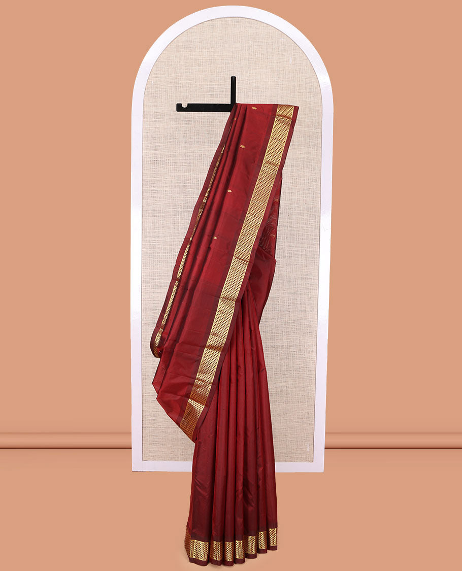 Red Kanchipuram Silk Saree, Adorned with Zari Buttas, Complemented by a Semi-Contrast Ara Madam Border, Pallu of Zari Design, and Matching Blouse