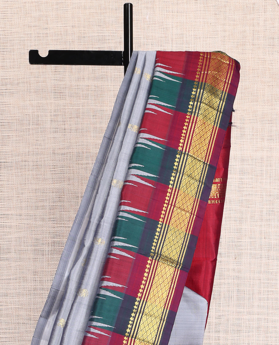 Grey Kanchipuram Silk Saree, Elevated with Zari Buttas, a Contrast One-Sided Border of Thazhampoo Rekku, Paneer Sombu, Banaras and Mayil Kann Design, Zari Design Pallu, and No Blouse