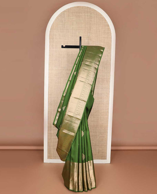 Green geometric buttas kancheepuram silk saree with self border of rekku, poo chakram, mayil banaras design & zari design pallu