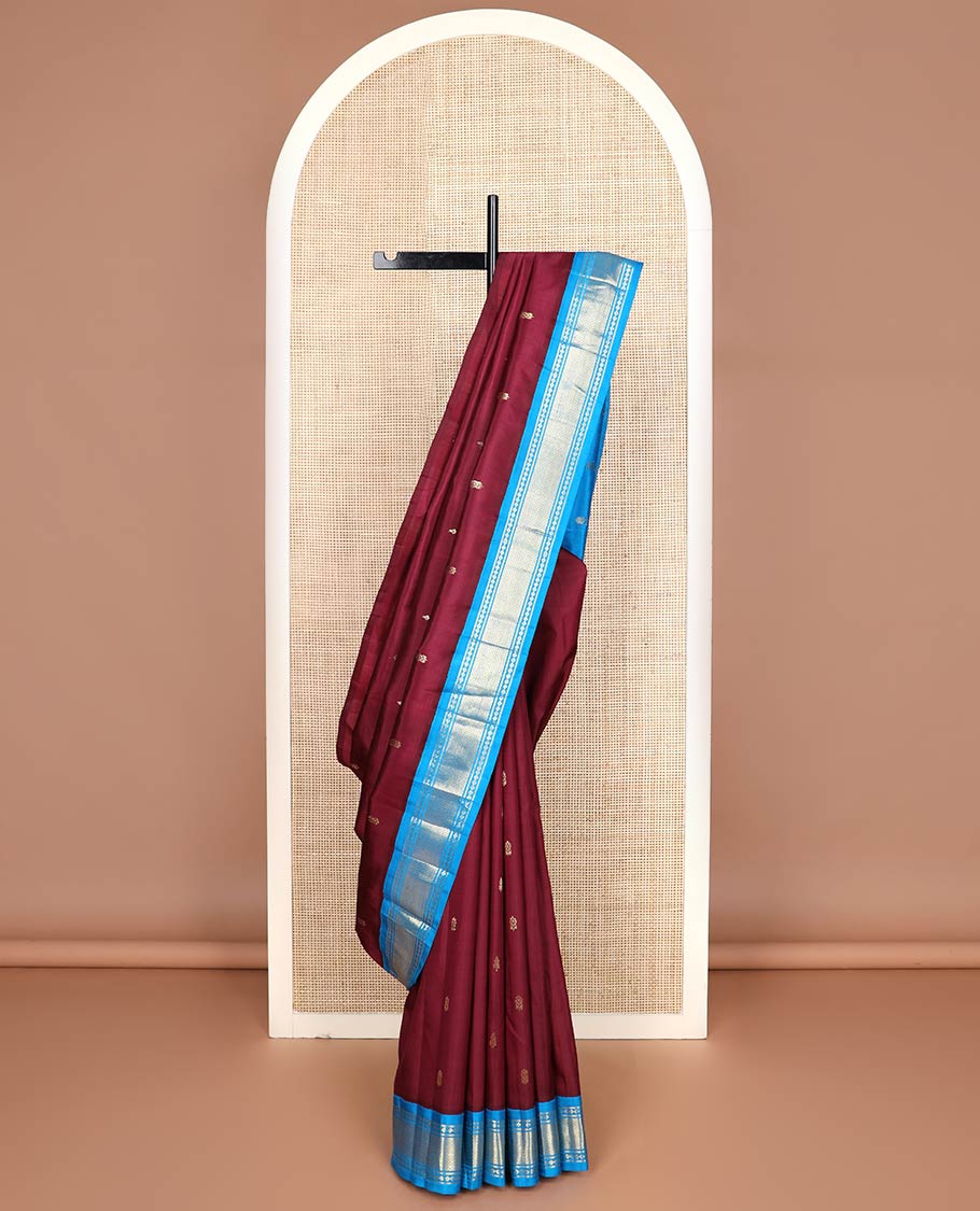 Maroon zari buttas kanchipuram silk saree, contrast one-sided korvai border of lavangam & mayil kann designs & zari design pallu