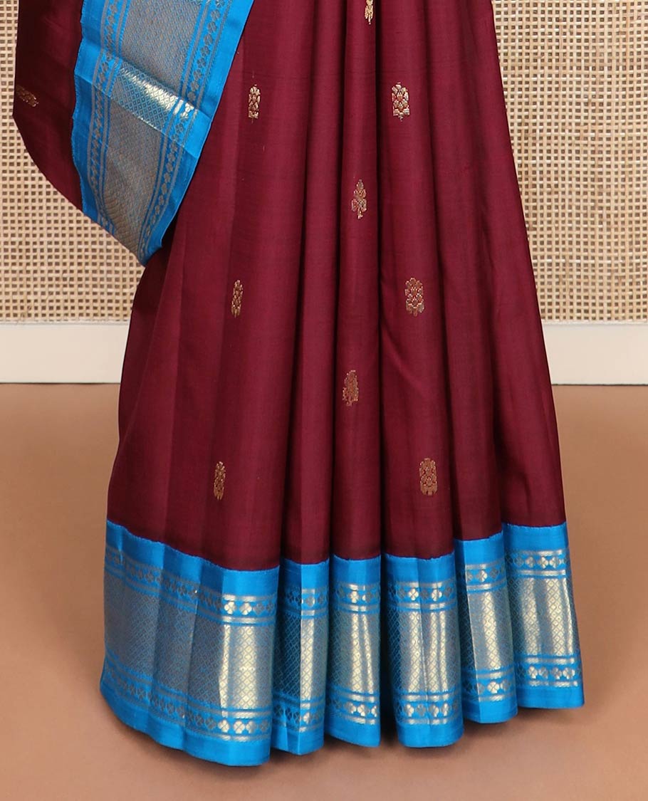 Maroon zari buttas kanchipuram silk saree, contrast one-sided korvai border of lavangam & mayil kann designs & zari design pallu