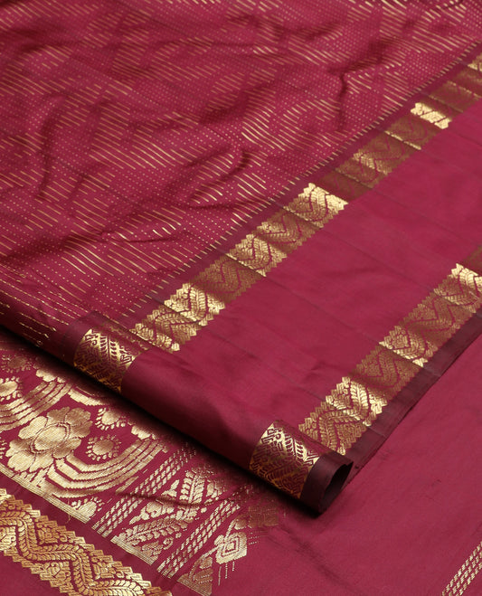 Maroon zari buttas Kanchipuram silk saree, one-sided rettai pettu zari border, and intricately designed pallu