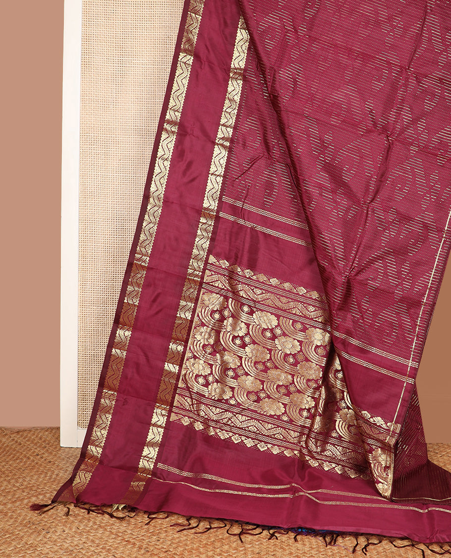 Maroon zari buttas Kanchipuram silk saree, one-sided rettai pettu zari border, and intricately designed pallu