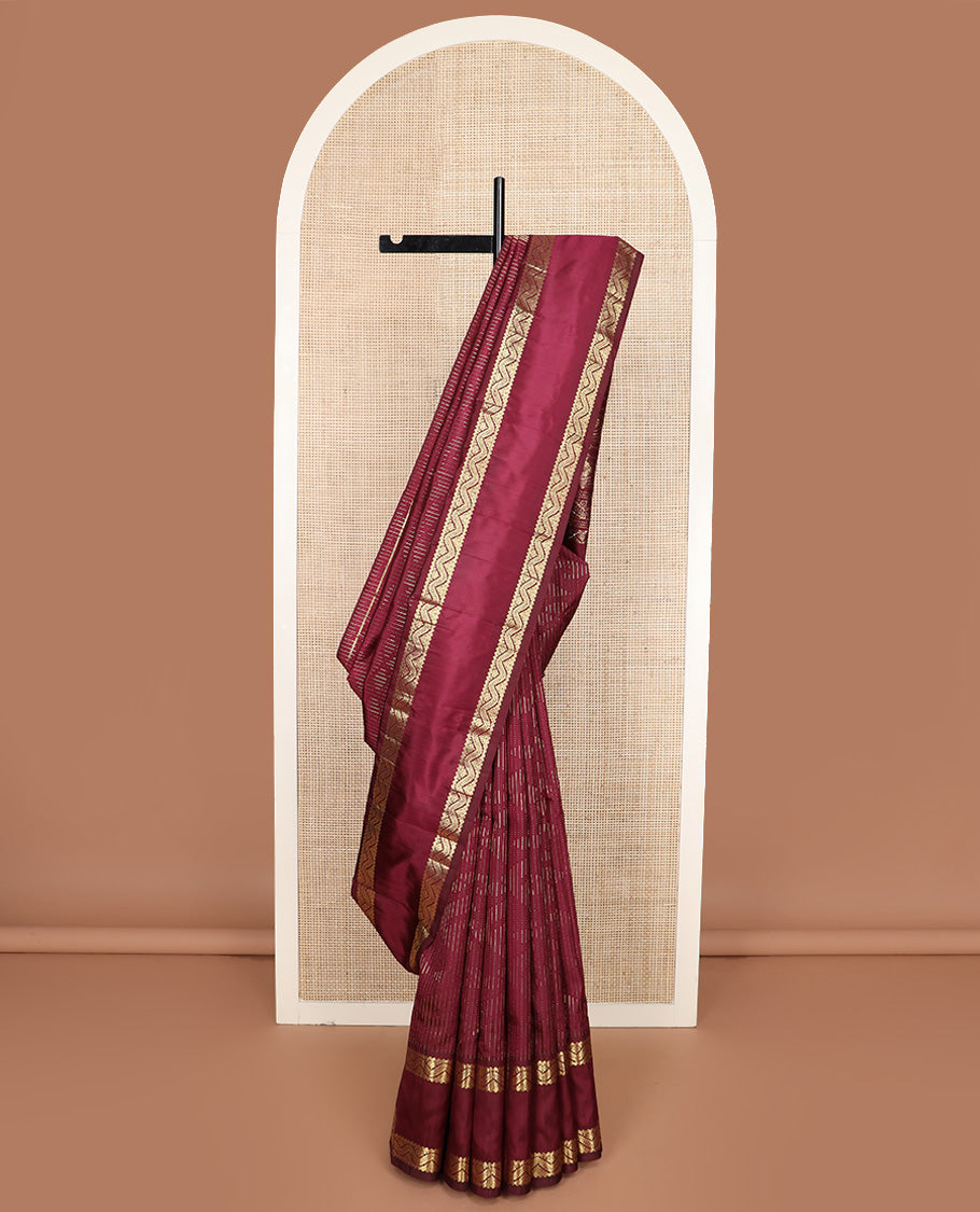 Maroon zari buttas Kanchipuram silk saree, one-sided rettai pettu zari border, and intricately designed pallu