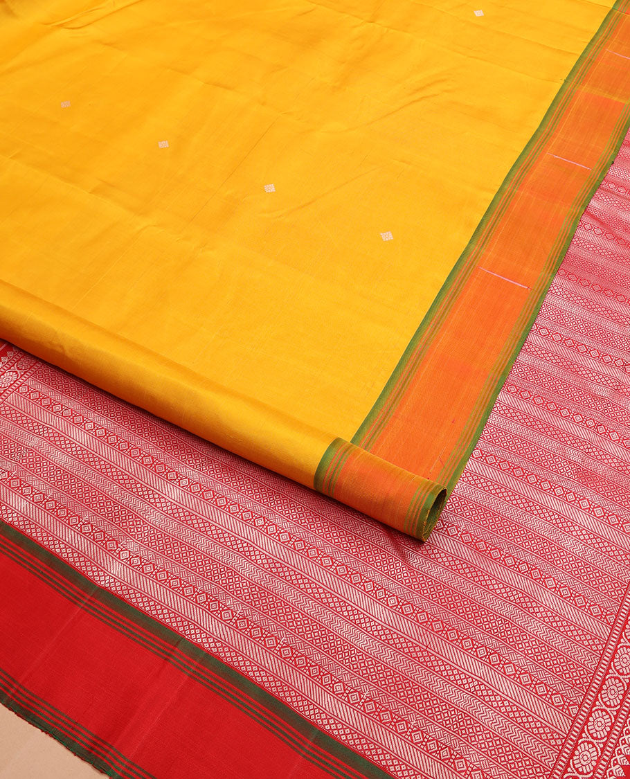 Yellow buttas Kanchipuram silk saree, contrast border of malli mokku designs, and pallu of geometric designs