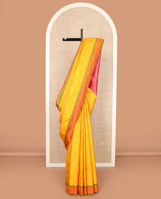 Yellow buttas Kanchipuram silk saree, contrast border of malli mokku designs, and pallu of geometric designs