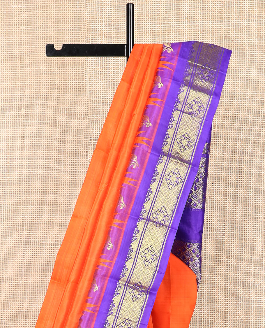 Orange zari buttas  Kanchipuram silk saree, contrast thazampoo rekku border, and pallu of intricate zari designs