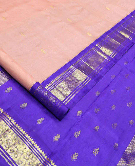 Peach zari buttas Kanchipuram silk saree, contrast one-sided korvai border of thilakam mokku, banaras, and jaal designs, and zari design pallu