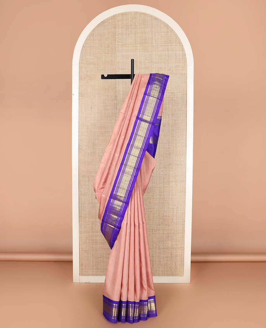 Peach zari buttas Kanchipuram silk saree, contrast one-sided korvai border of thilakam mokku, banaras, and jaal designs, and zari design pallu