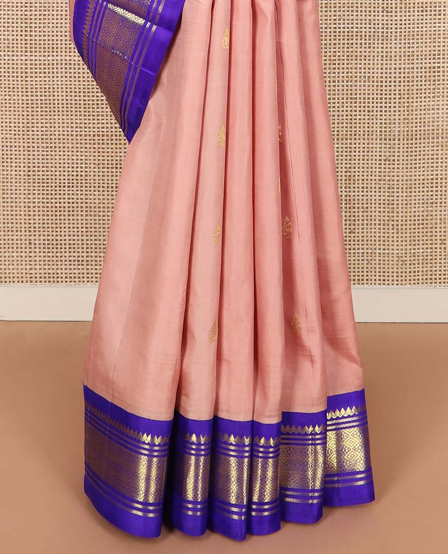 Peach zari buttas Kanchipuram silk saree, contrast one-sided korvai border of thilakam mokku, banaras, and jaal designs, and zari design pallu