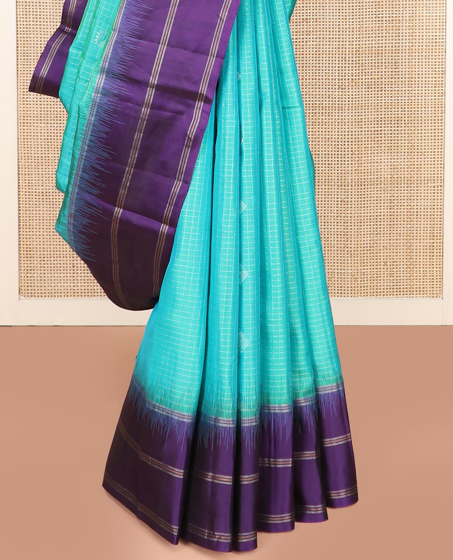 Blue Kanchipuram Silk Saree Elevated with Buttas and Checks All Over Its Body, Complemented by a Contrast Border of Stripes, Featuring Pallu of Intricate Designs, and Paired with a Contrast Blouse