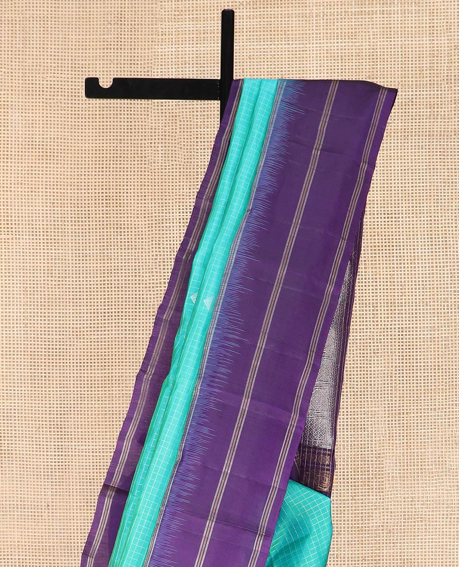 Blue Kanchipuram Silk Saree Elevated with Buttas and Checks All Over Its Body, Complemented by a Contrast Border of Stripes, Featuring Pallu of Intricate Designs, and Paired with a Contrast Blouse