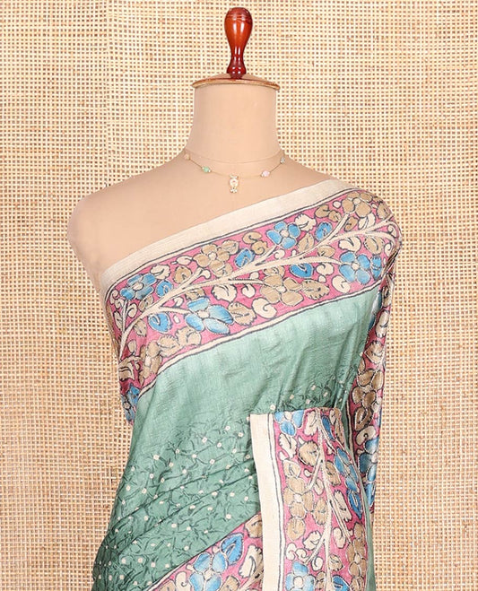 Green Semi-Tussar Saree Enriched with Bandhani Dots, Complemented by a Contrast Kalamkari Floral Creeper Printed with Kantha Work Border, Pallu Featuring Floral Print Kantha Work, and Paired with a Contrast Printed Blouse