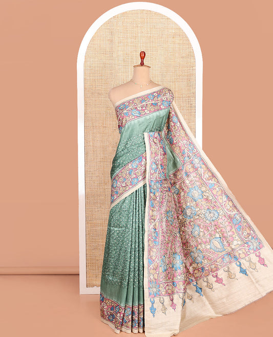 Green Semi-Tussar Saree Enriched with Bandhani Dots, Complemented by a Contrast Kalamkari Floral Creeper Printed with Kantha Work Border, Pallu Featuring Floral Print Kantha Work, and Paired with a Contrast Printed Blouse
