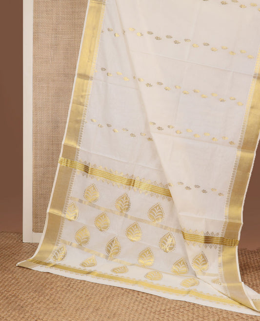 Cream zari buttas Kerala saree, zari border, and pallu of spade shape motifs