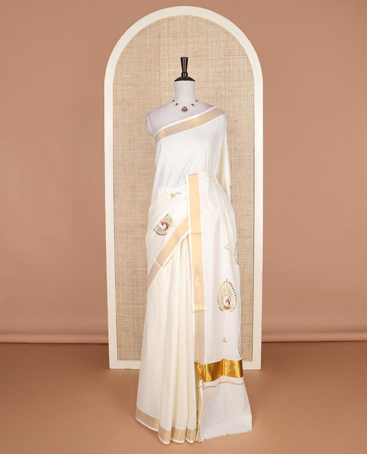 Cream peacock embroidered Kerala cotton saree, bavanji border, and pallu of peacock embroidery