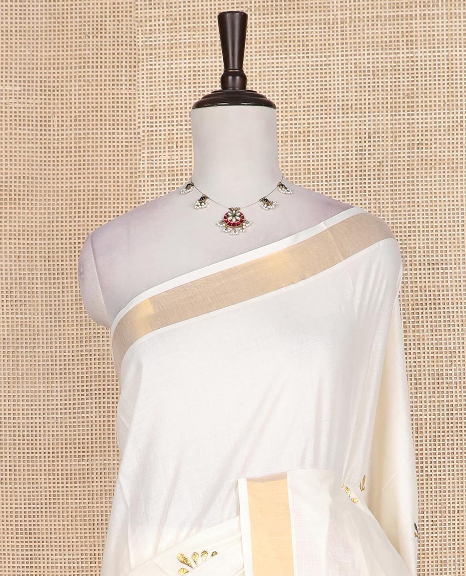 Cream peacock embroidered Kerala cotton saree, bavanji border, and pallu of peacock embroidery