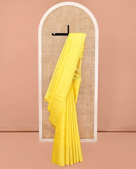 Yellow Mayuri Soft Silk Saree, Sparsely Sparkled with Malli Mokku Buttas All Over Its Body, Highlighted by Zari Striped Border, Pallu of Intricate Designs, and Paired with a Matching Blouse