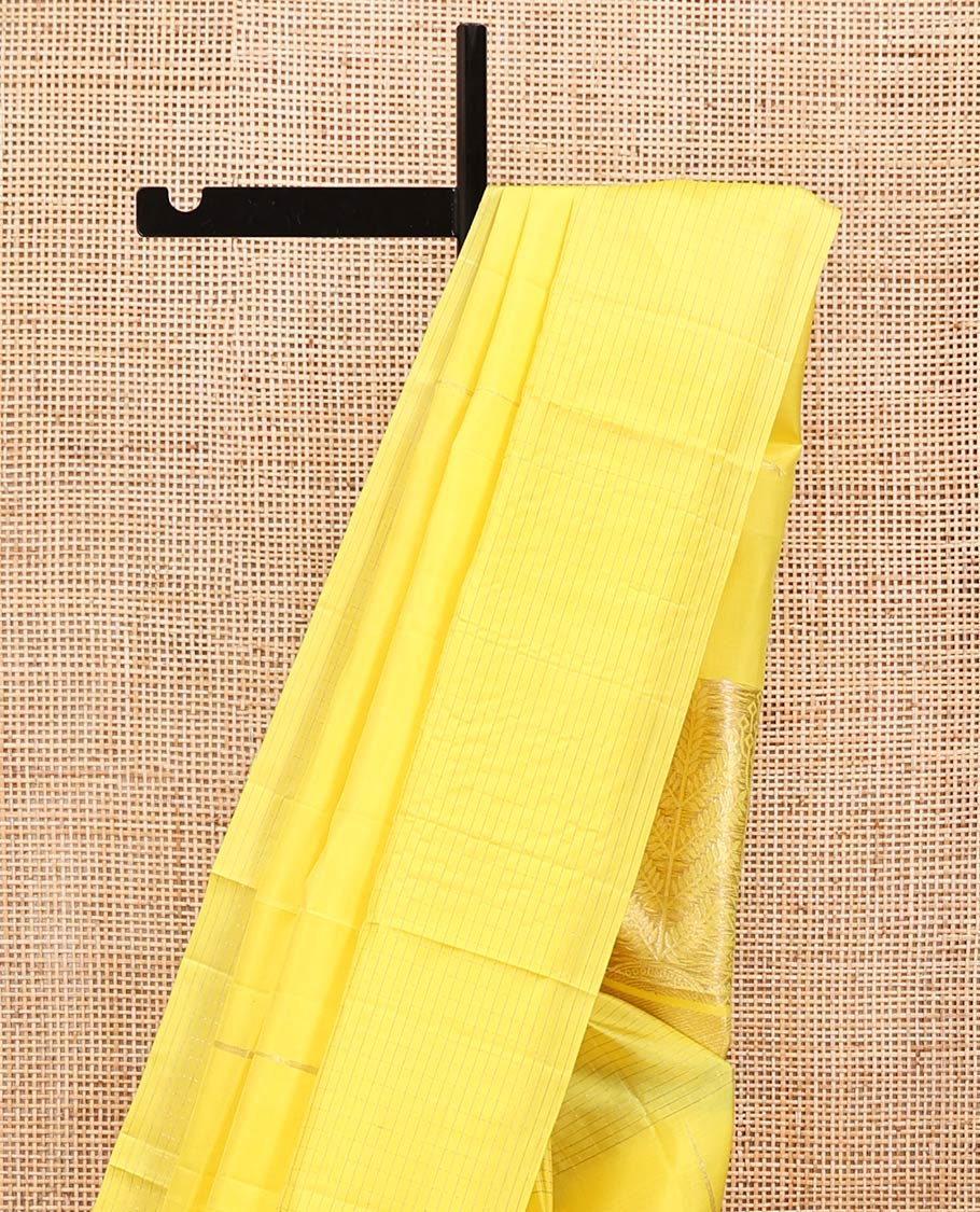 Yellow Mayuri Soft Silk Saree, Sparsely Sparkled with Malli Mokku Buttas All Over Its Body, Highlighted by Zari Striped Border, Pallu of Intricate Designs, and Paired with a Matching Blouse