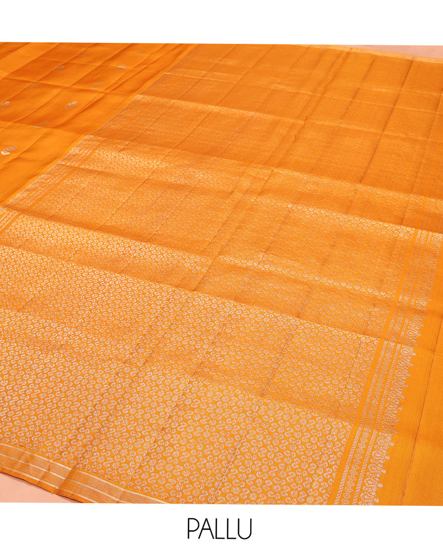 Orange Mayuri Soft Silk Saree, Elegantly Woven with Floral Zari Buttas on Its Body, Subtle Piping Border, Majestically Detailed Pallu, and Paired with a Matching Blouse
