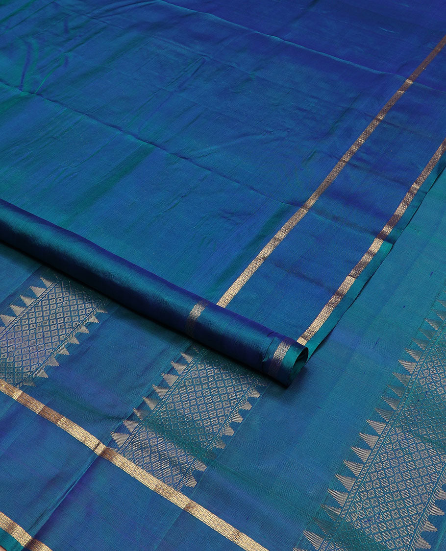 Blue plain nine-yard silk saree, rettai pettu zari mayil kann border, and pallu of rekku, and mayil kann designs