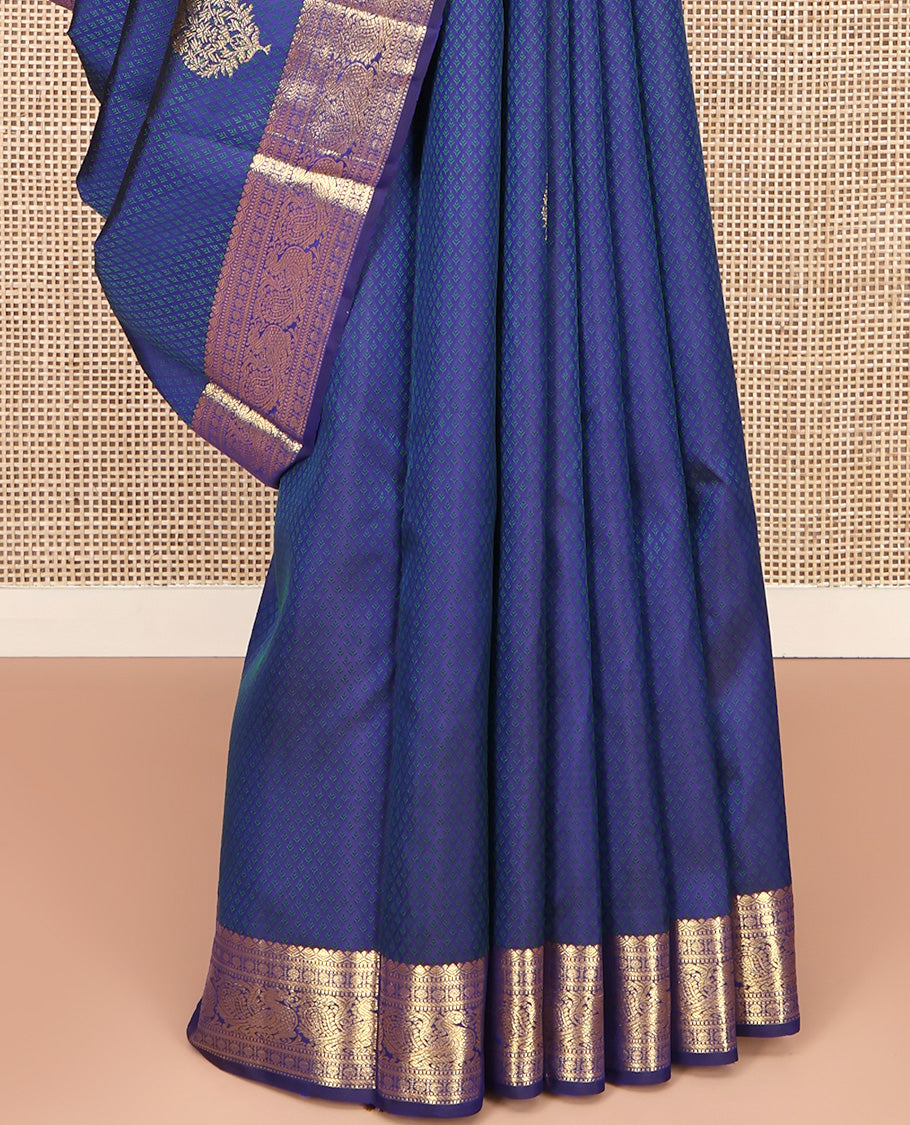 Blue Parampara Silk Saree, Graced with Zari Buttas and Embossed Texture On Its Body Highlighted by Zari Border of Muthu, Poun, and Mayil Designs, Pallu of Ara Maadam Designs, and Paired with a Matching Blouse