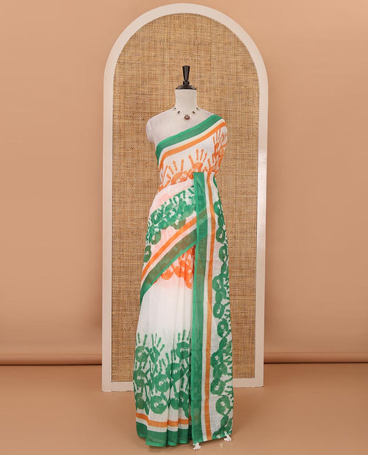 White-base batik National flag-theme printed linen saree features tri-color handprints, contrast border & green plain blouse
