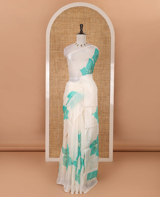 Cream floral placement-style printed Marble chiffon saree, zari border & contrast rama green gotta patti work & mixed embroidered blouse
