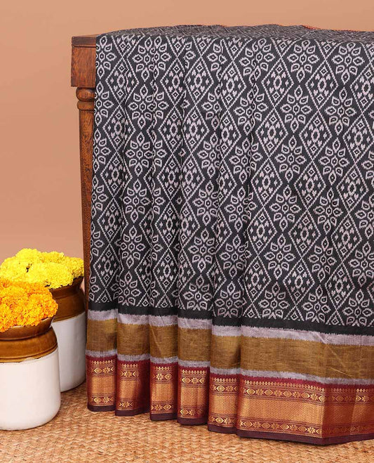 Black pochampally design semi- patola saree with traditional border