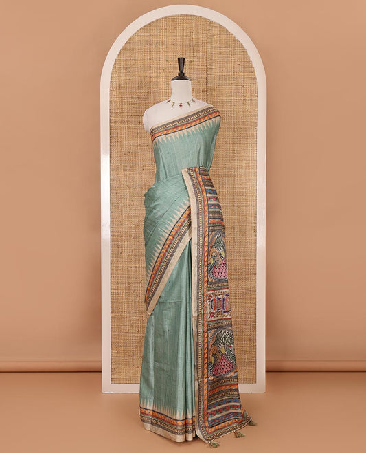 Green plain semi-tussar saree, contrast temple geometric printed border, kaleidoscope-colored Madhubani-style printed pallu & contrast plain blouse