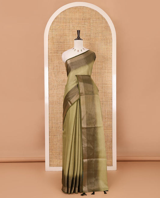 Olive green plain tissue saree, contrast gold zari piping border & self pallu with tussels