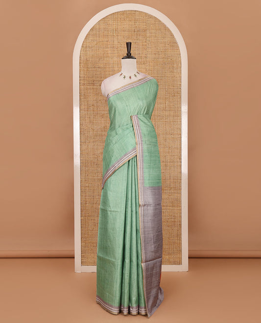 Parrot green full-plain design semi-tussar saree, contrast thread triangle motifs border, bird motifs printed pallu & contrast striped blouse